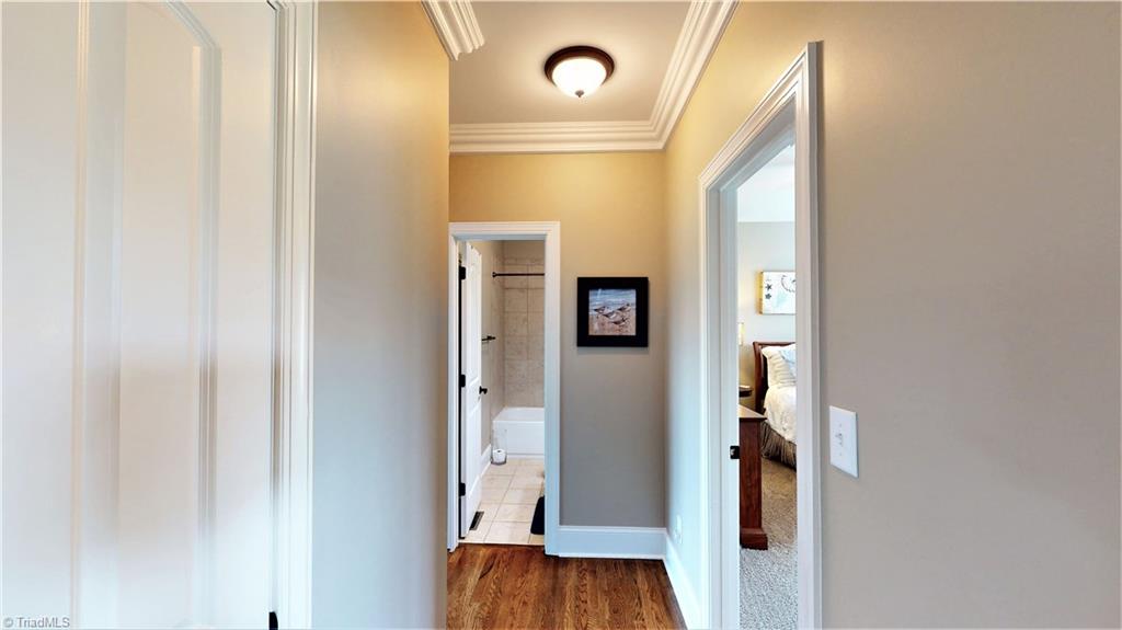 8887 Rymack Drive Oak Ridge, NC 27310 - Photo 19 of 30 Hallway to bedrooms on main level