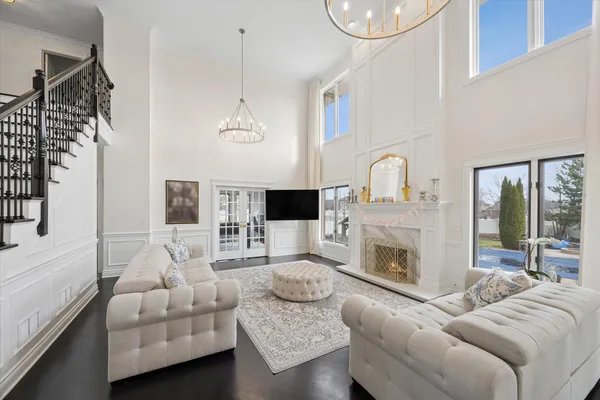 a living room with furniture fireplace and a flat screen tv
