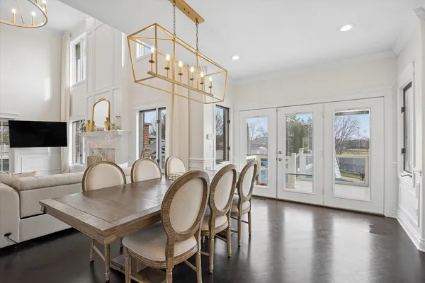 a dining room with furniture a livingroom and chandelier