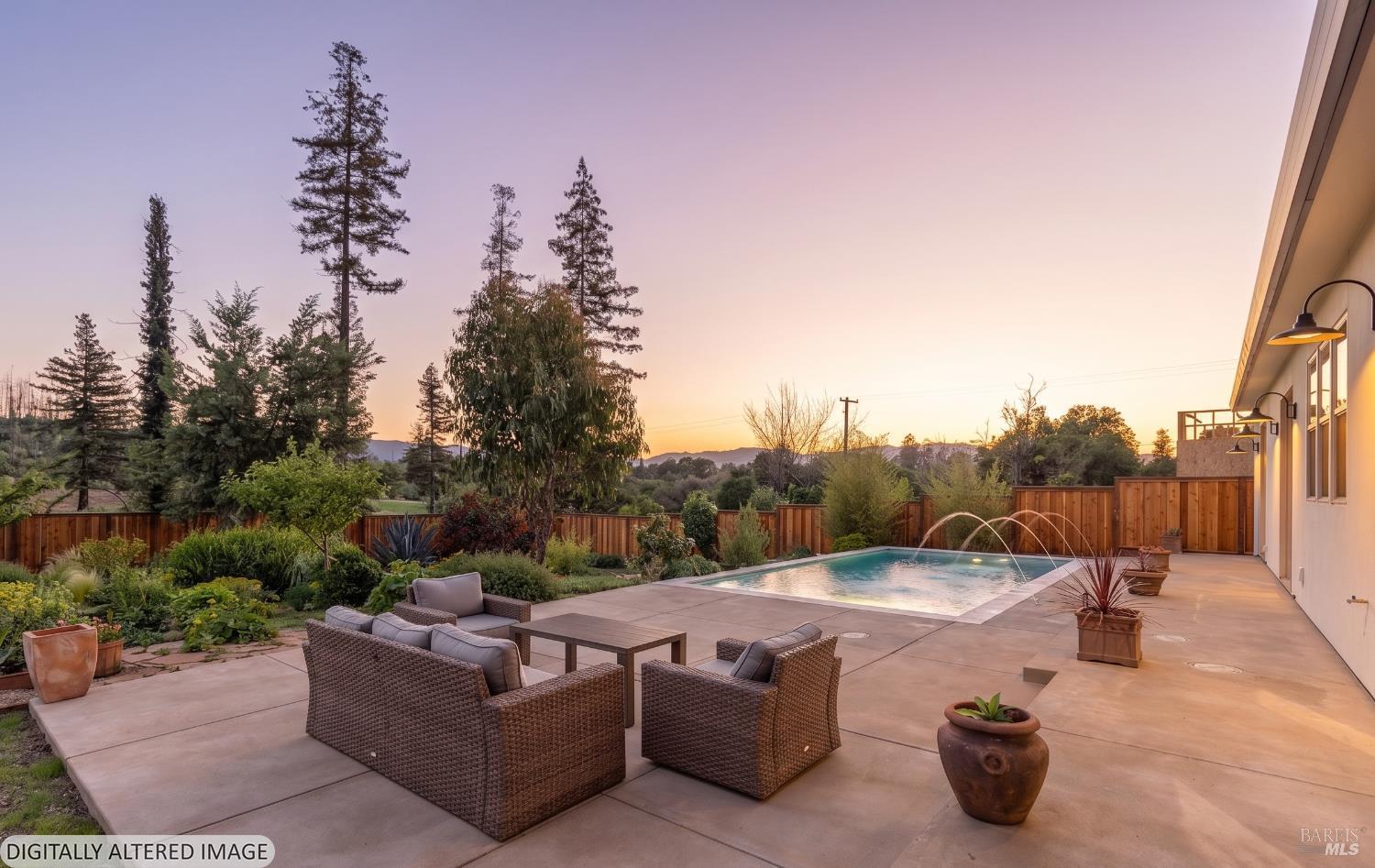 753 Sunnyside Road St. Helena, CA 94574 - Photo 41 of 55 a view of a terrace with a couch and a fire pit in the background