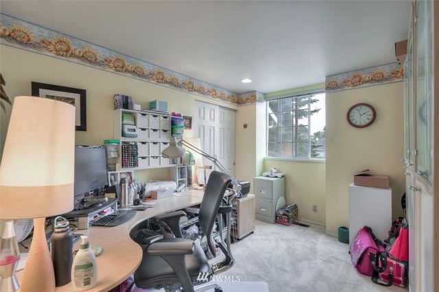 a view of a workspace with furniture and toys