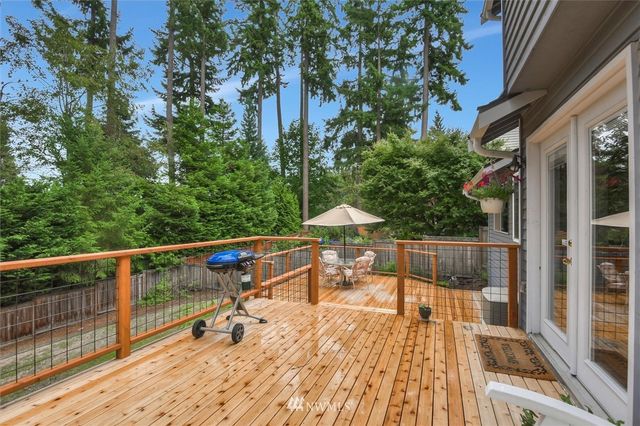 a view of roof deck with furniture and wooden floor