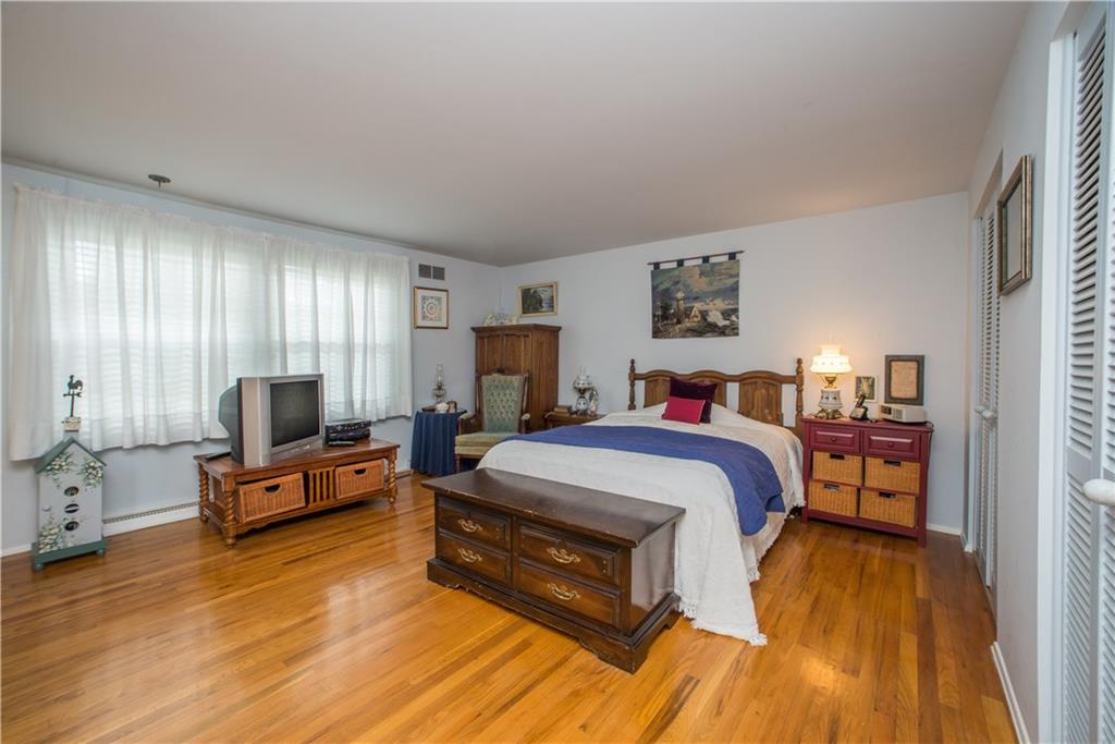 1484 Mayview Road Pittsburgh, PA 15241 - Photo 12 of 25 The spacious master bedroom is found on the front of the home and measures 16x15. It has neutrally-toned walls, gleaming hardwood floor, and is outfitted with two double closets.