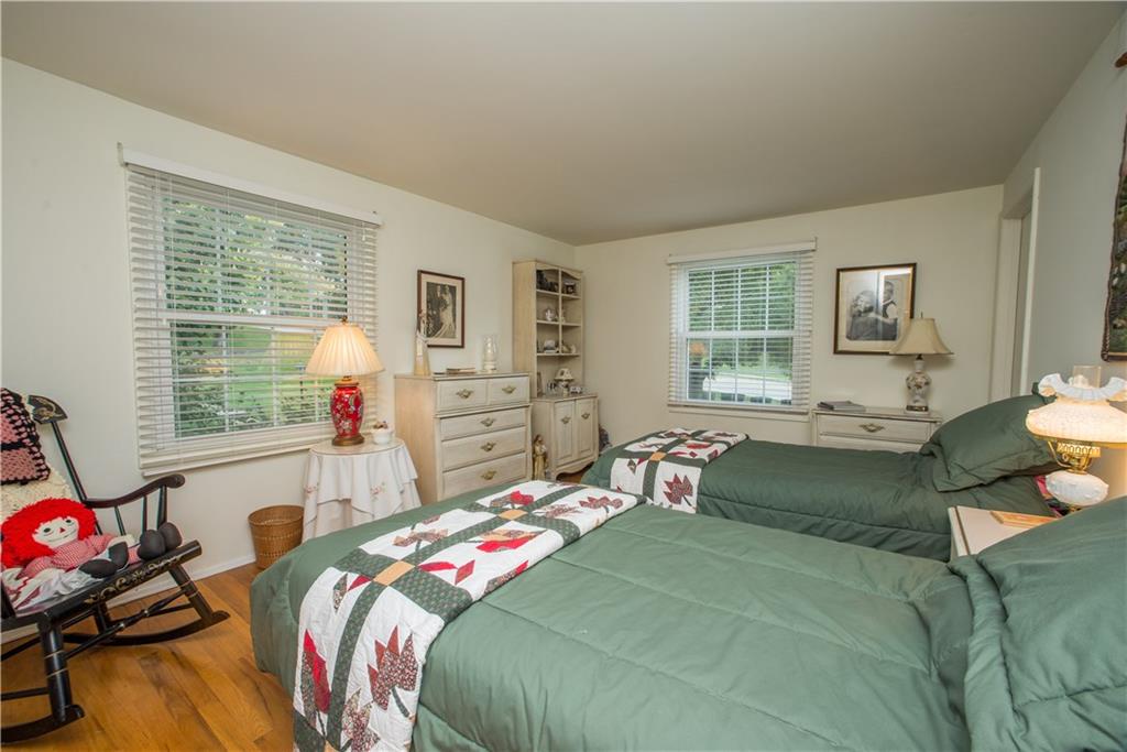 1484 Mayview Road Pittsburgh, PA 15241 - Photo 15 of 25 Bedroom two also offers hardwood flooring and access to the semi-private bath shared with the master bedroom. Windows here face the front and left-side of the home.
