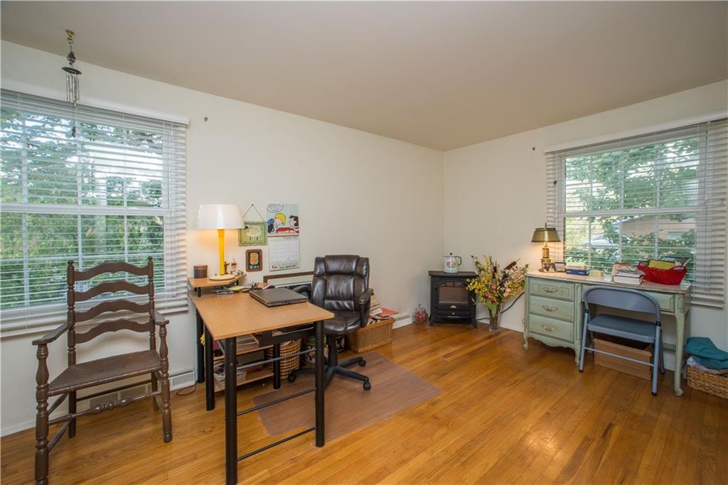 1484 Mayview Road Pittsburgh, PA 15241 - Photo 19 of 25 Bedroom four is currently used as a home office. Natural light from windows on opposite walls adds to the soothing atmosphere found in this space.