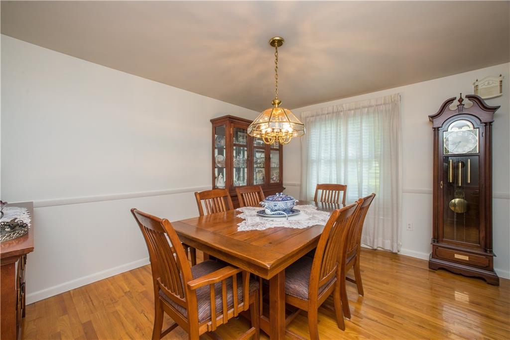 1484 Mayview Road Pittsburgh, PA 15241 - Photo 5 of 25 The formal dining room measures 13x11 and has hardwood floor, chair rail trim, and drop chandelier. The window shown here overlooks the front yard.