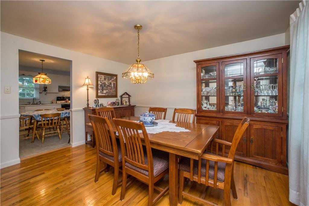 1484 Mayview Road Pittsburgh, PA 15241 - Photo 6 of 25 This opposite angle view of the dining room shows the opening into the kitchen.