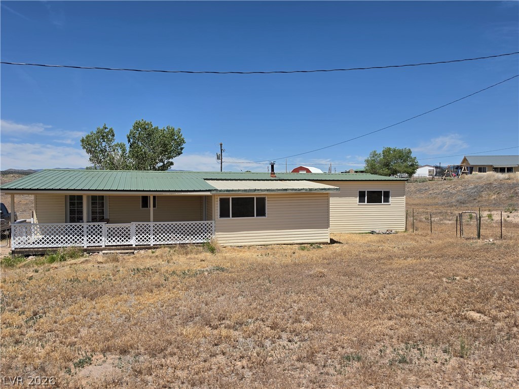 2930 Frehner Ranch Road Pioche, NV 89043 - Photo 10 of 39 A well-maintained facade with a covered porch and expansive yard creates inviting curb appeal.