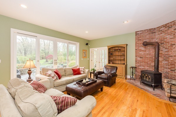 47 C Sheffield Road Boxford, MA 01921 - Photo 10 of 30 a living room with furniture large windows and a table
