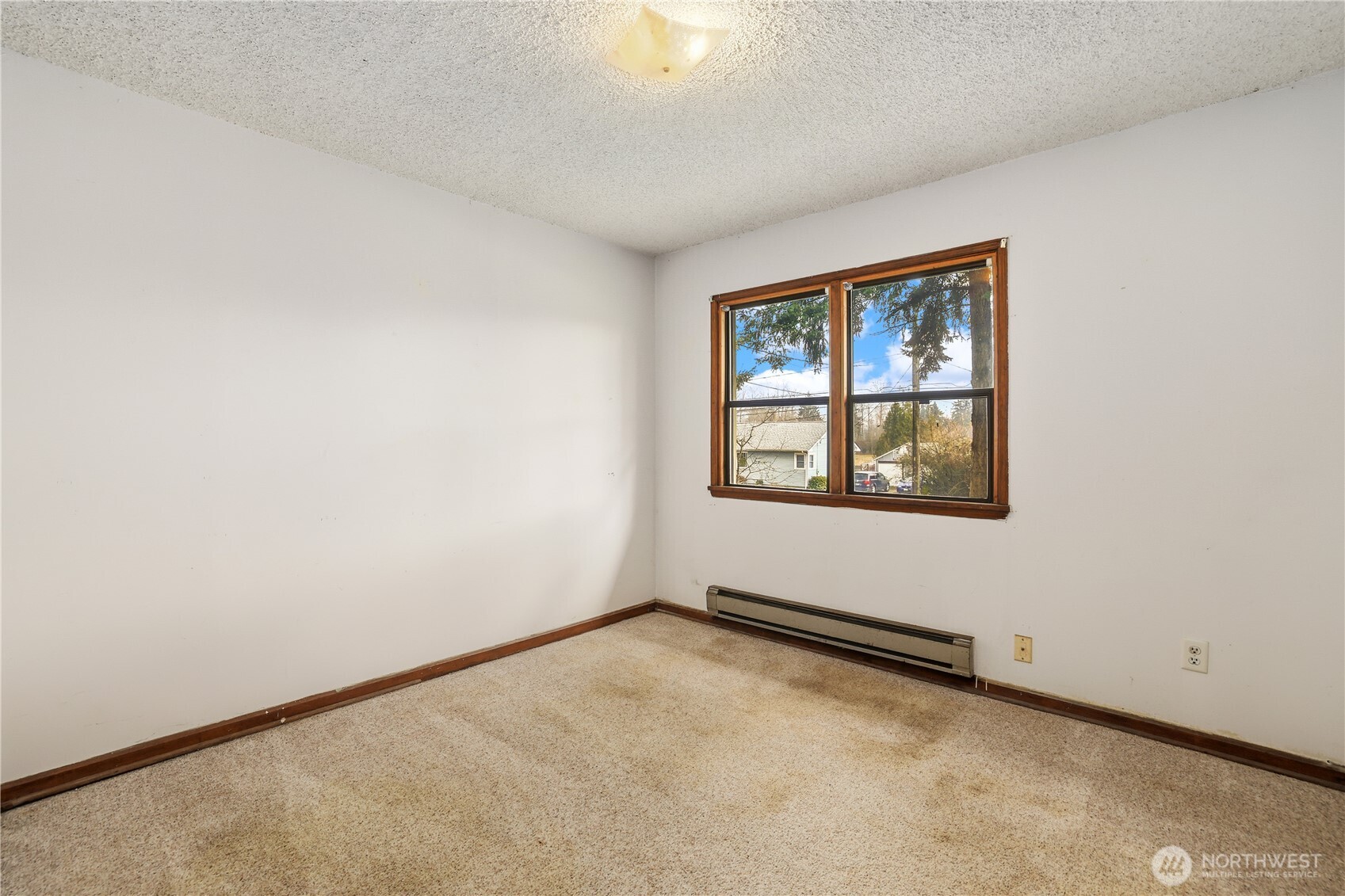 12204 Waller Road East Tacoma, WA 98446 - Photo 16 of 33 an empty room with windows
