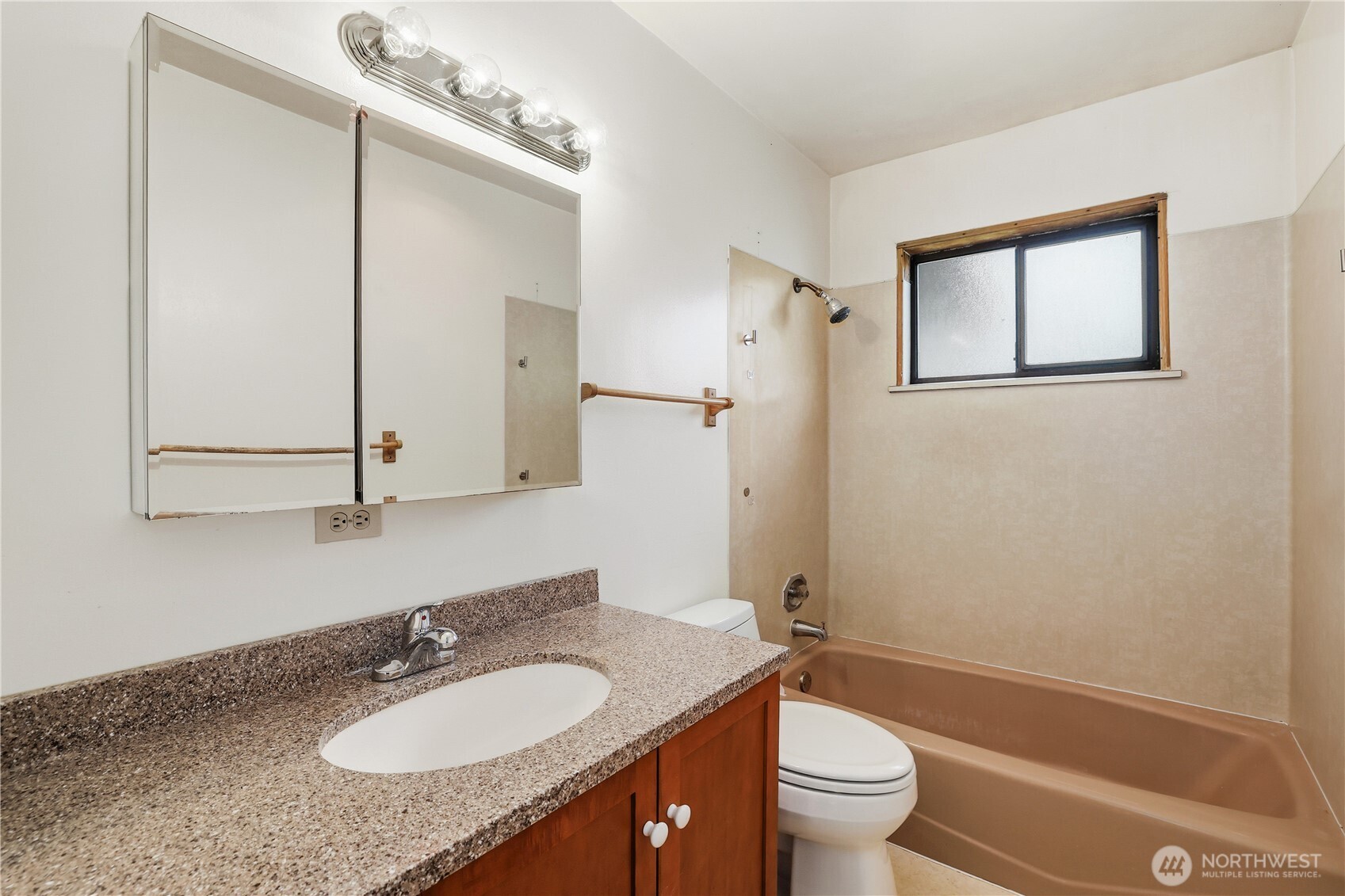 12204 Waller Road East Tacoma, WA 98446 - Photo 20 of 33 a bathroom with a granite countertop sink toilet and mirror