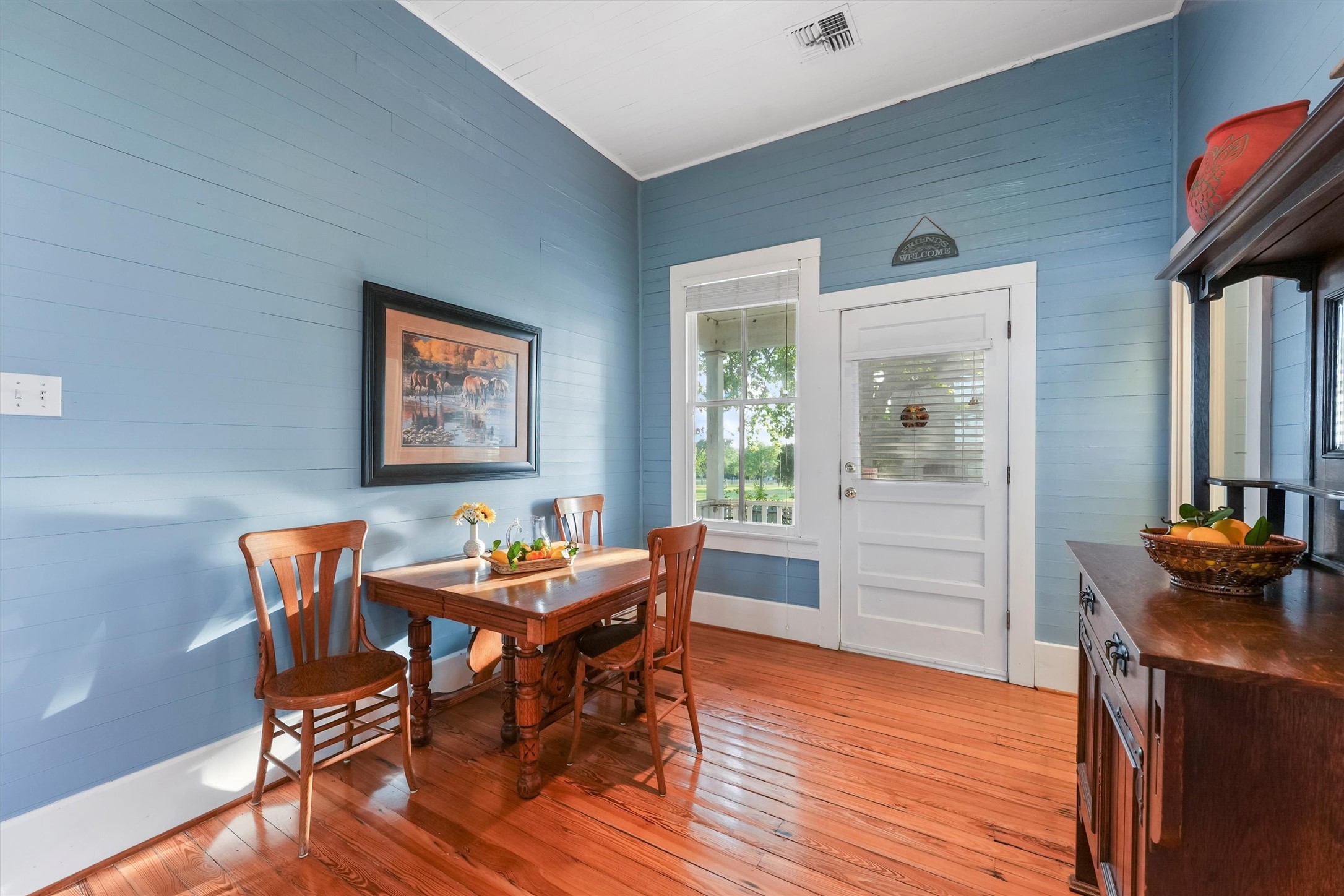 9058 Sam Houston Road Brenham, TX 77833 - Photo 14 of 49 a dining room with furniture and wooden floor
