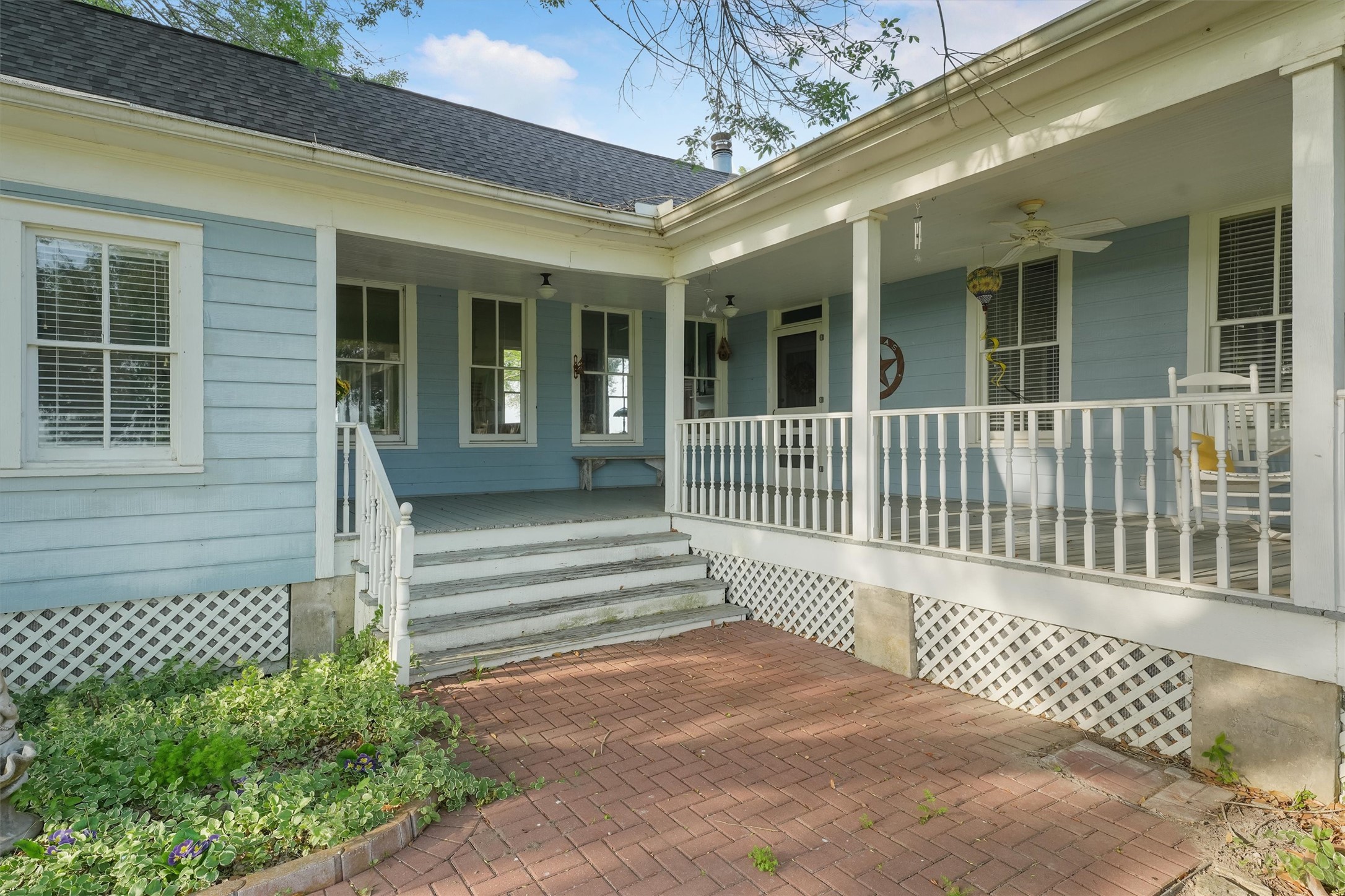 9058 Sam Houston Road Brenham, TX 77833 - Photo 22 of 49 a view of a brick house with a window