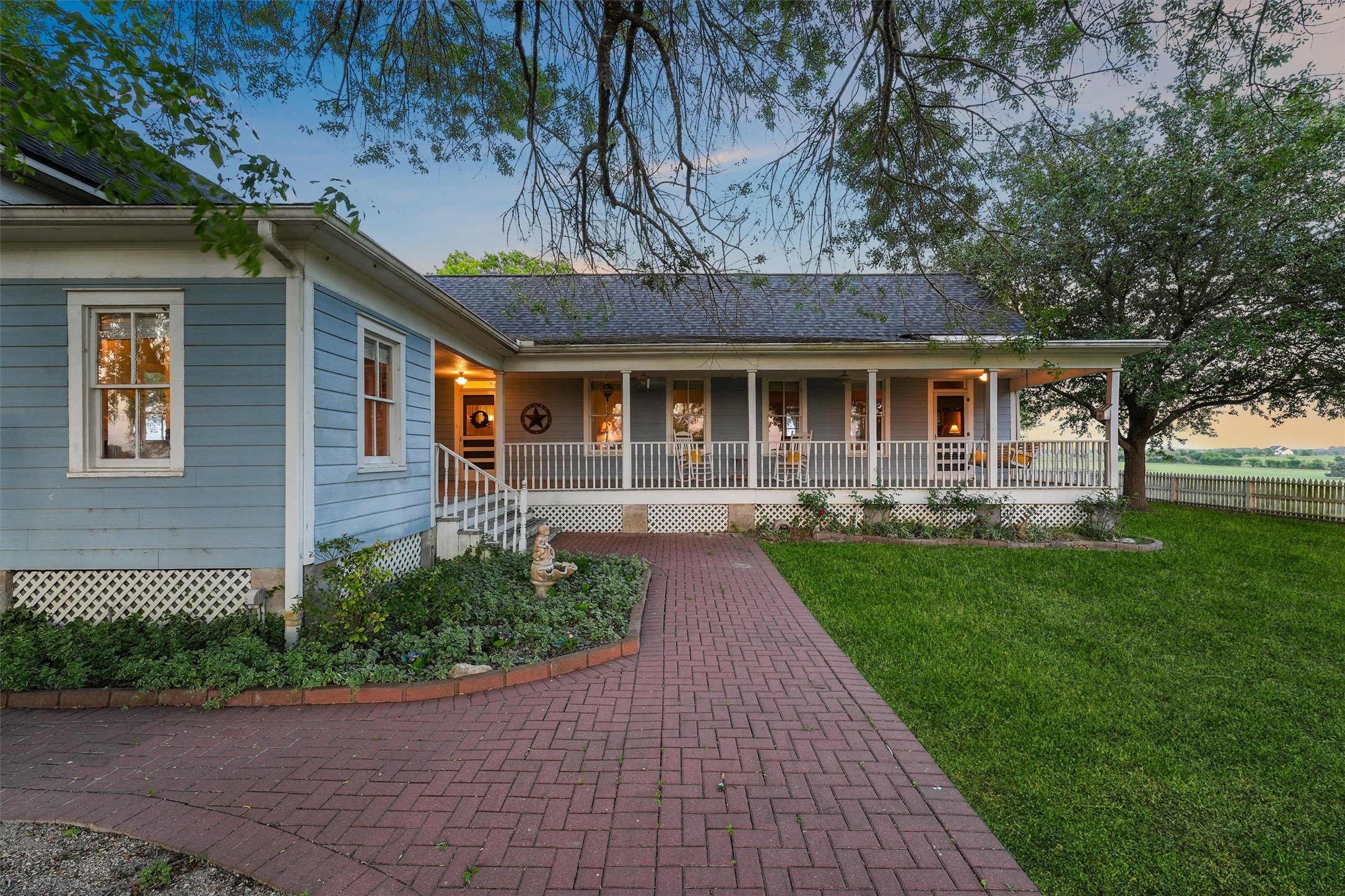 9058 Sam Houston Road Brenham, TX 77833 - Photo 26 of 49 a front view of a house with garden