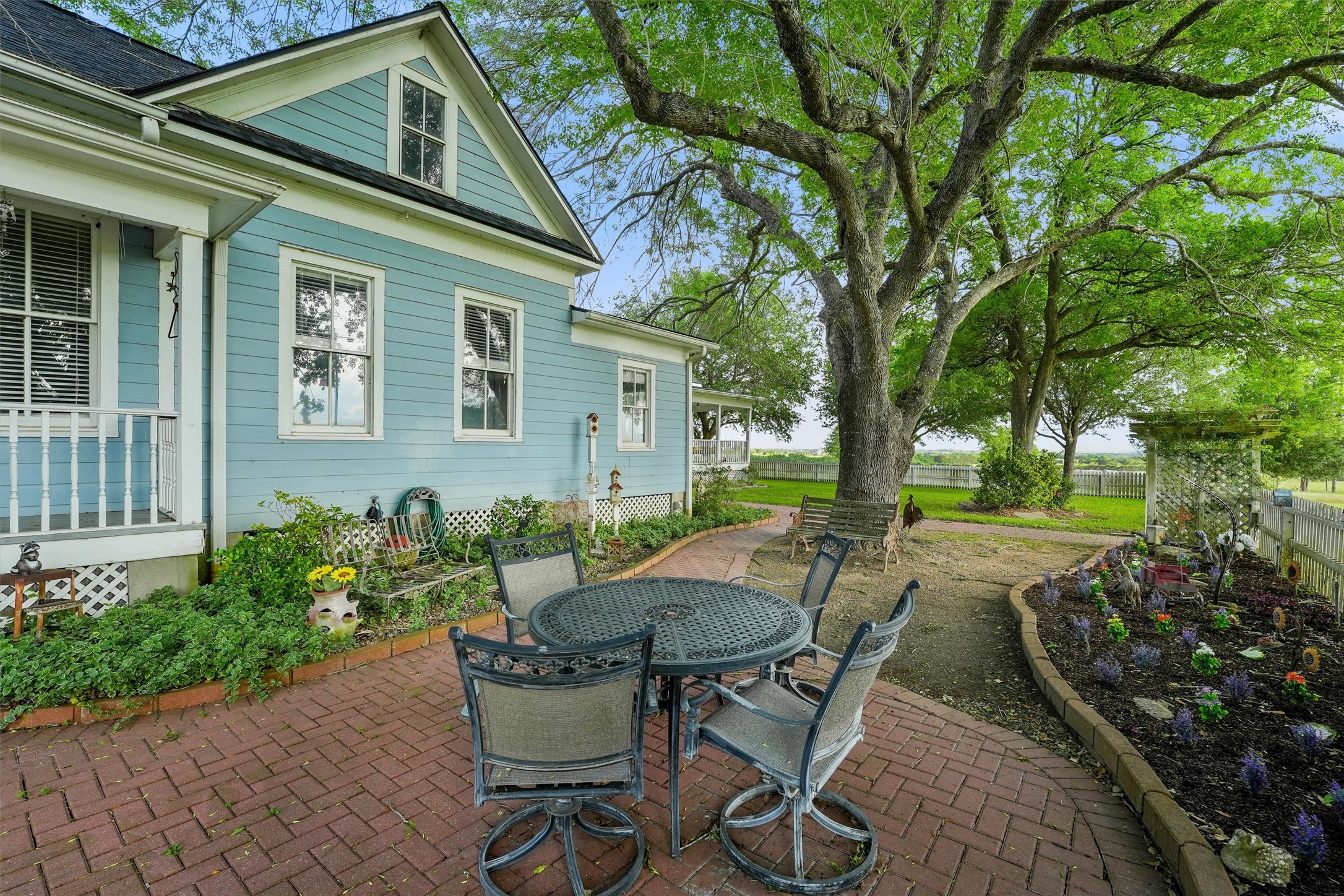 9058 Sam Houston Road Brenham, TX 77833 - Photo 39 of 49 a view of backyard with outdoor seating and green space