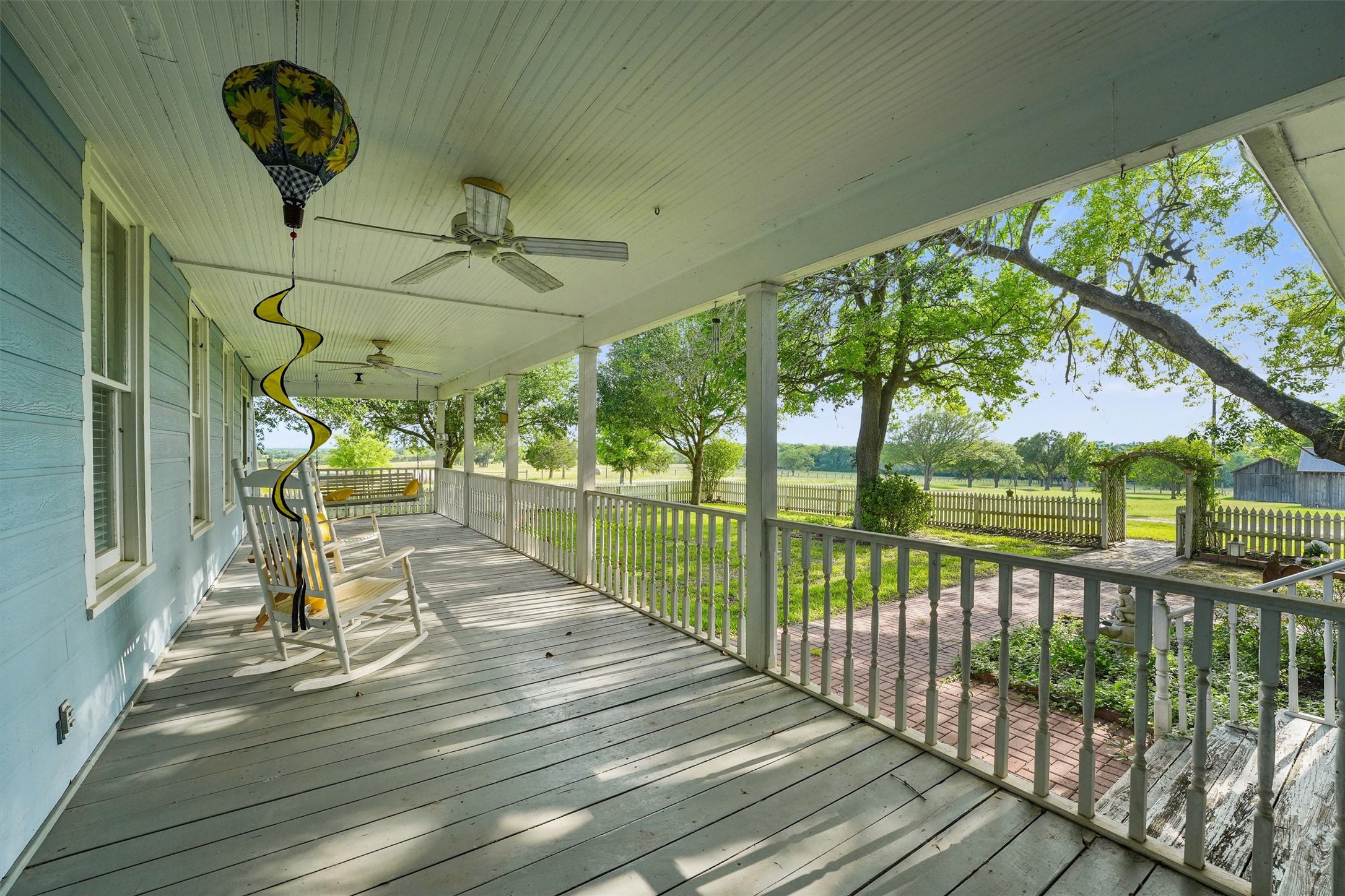 9058 Sam Houston Road Brenham, TX 77833 - Photo 41 of 49 a view of a porch with wooden floor