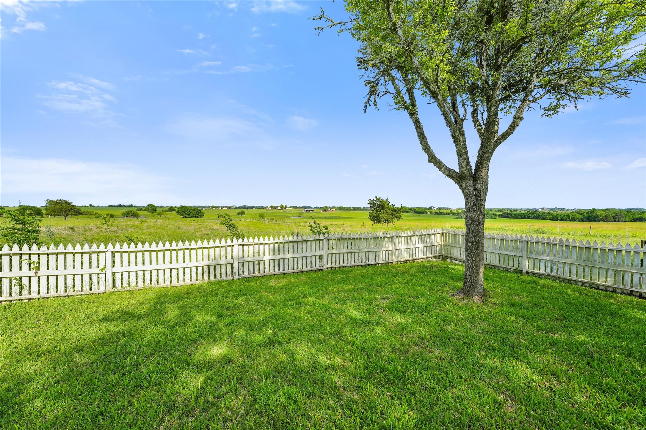 9058 Sam Houston Road Brenham, TX 77833 - Photo 44 of 49 a view of a yard with wooden fence