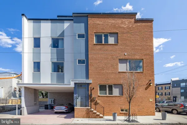 a front view of a building with street