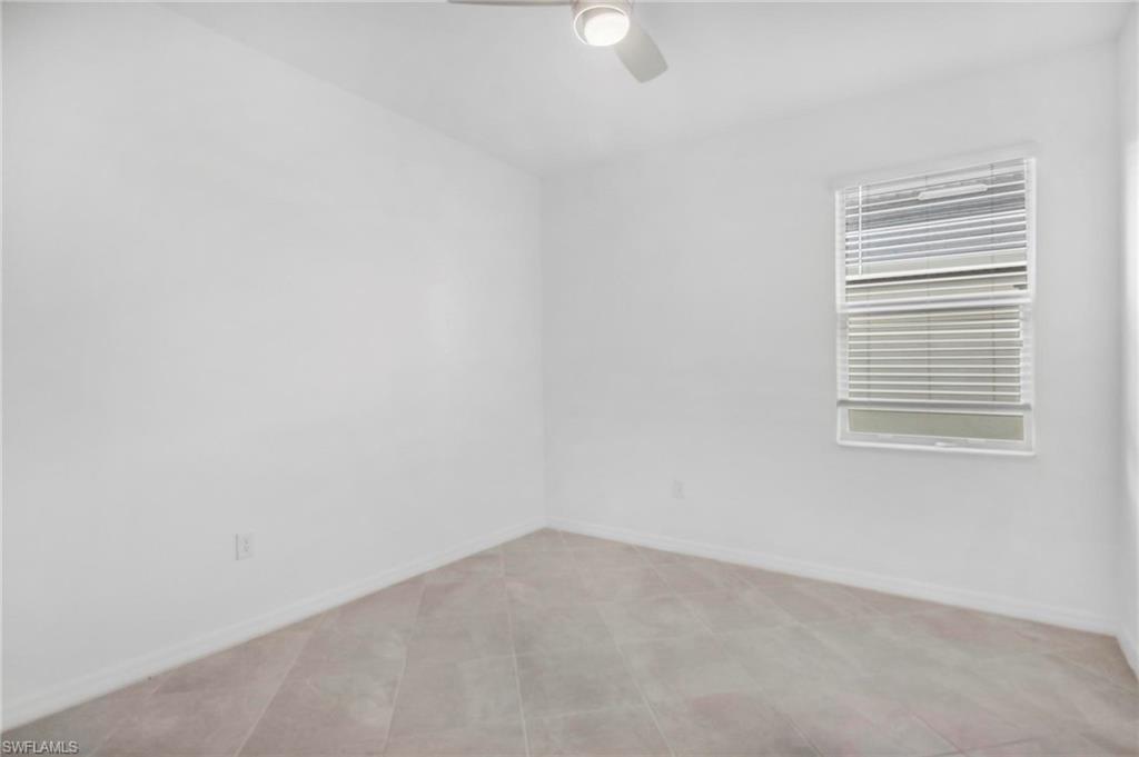 2265 Avocado Lane Naples, FL 34102 - Photo 11 of 32 a view of an empty room with a window