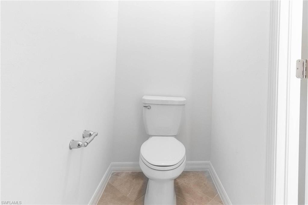 2265 Avocado Lane Naples, FL 34102 - Photo 15 of 32 a bathroom with a toilet