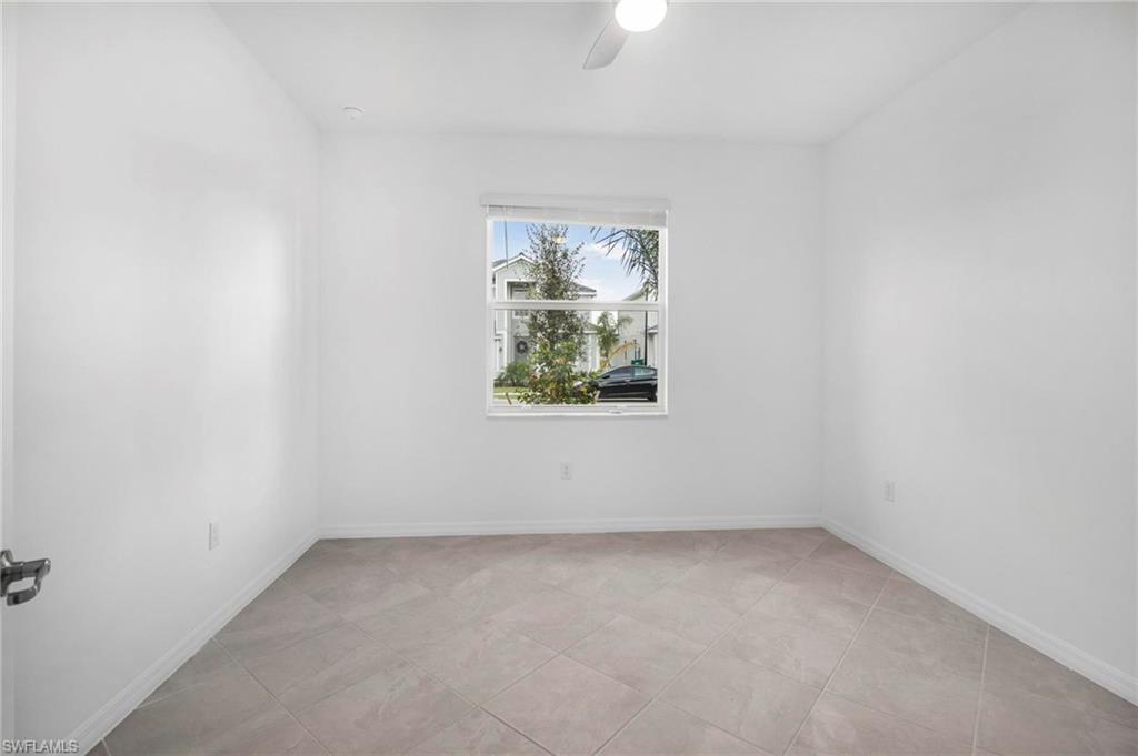 2265 Avocado Lane Naples, FL 34102 - Photo 17 of 32 an empty room with a window