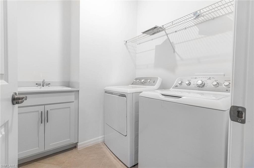 2265 Avocado Lane Naples, FL 34102 - Photo 20 of 32 a utility room with dryer and washer