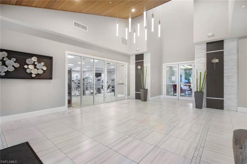 2265 Avocado Lane Naples, FL 34102 - Photo 23 of 32 a view of livingroom with furniture and window