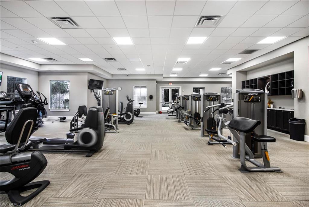 2265 Avocado Lane Naples, FL 34102 - Photo 24 of 32 a view of a room with gym equipment