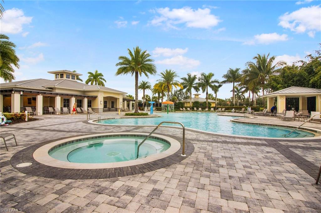 2265 Avocado Lane Naples, FL 34102 - Photo 28 of 32 a view of swimming pool with a yard