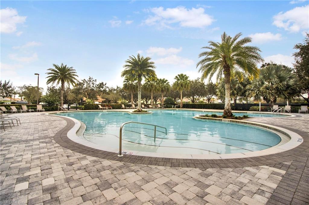 2265 Avocado Lane Naples, FL 34102 - Photo 29 of 32 a view of outdoor space with swimming pool and lake view