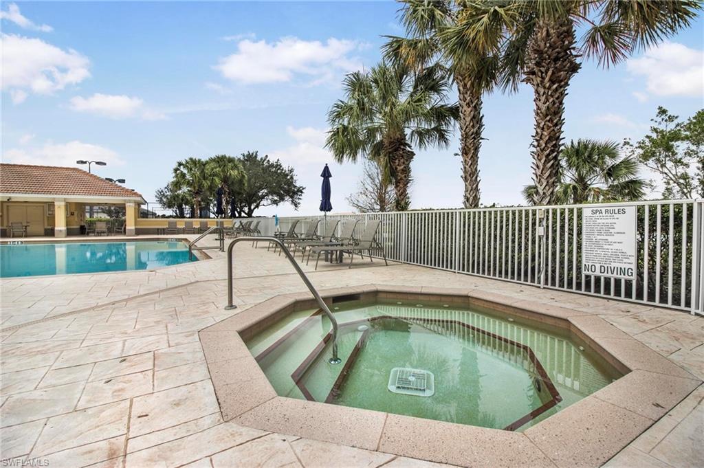 2265 Avocado Lane Naples, FL 34102 - Photo 30 of 32 a view of swimming pool with a yard