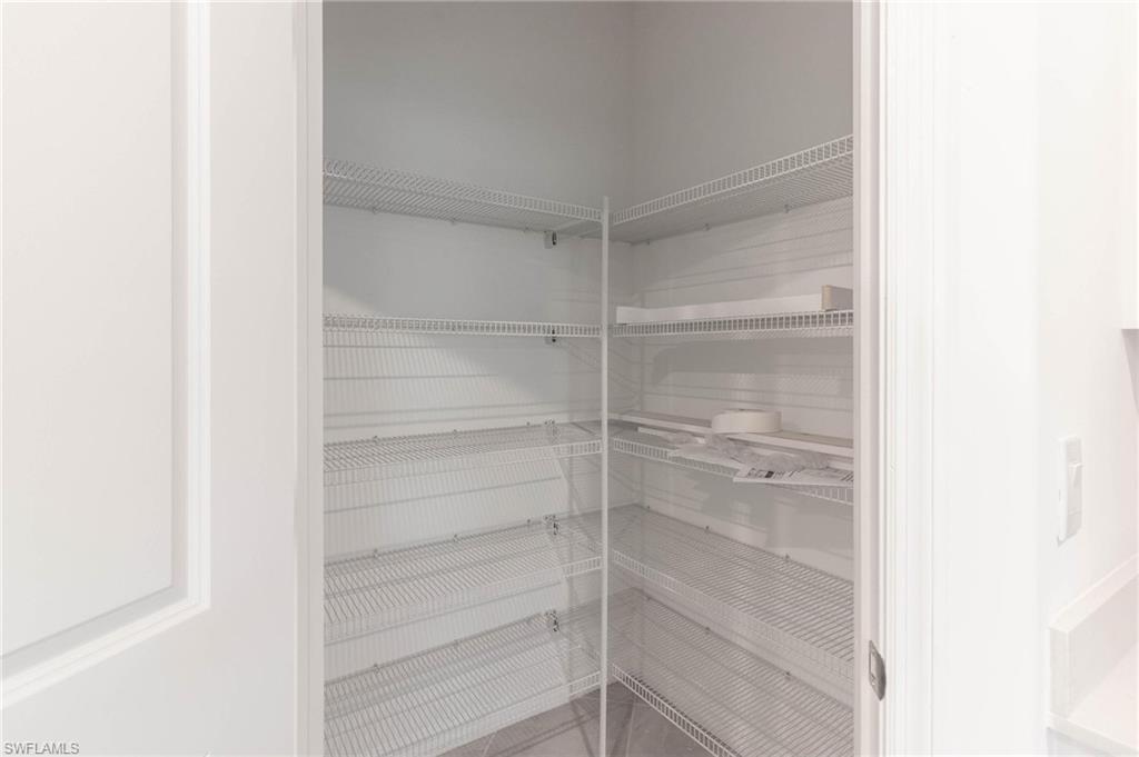 2265 Avocado Lane Naples, FL 34102 - Photo 10 of 32 a empty closet with white paint