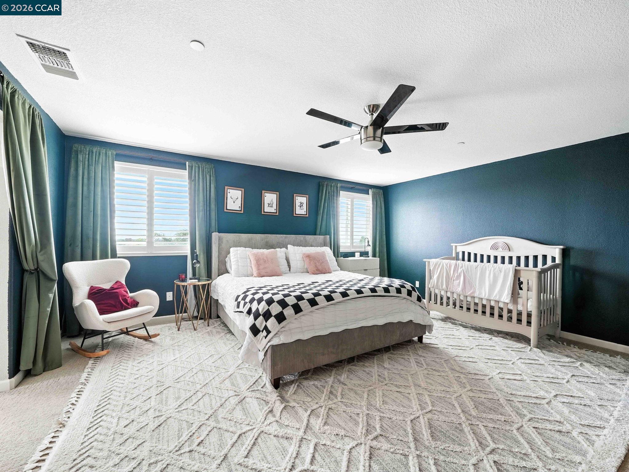 2433 Sanders Lane Fairfield, CA 94533 - Photo 11 of 51 a spacious bedroom with a bed and a window