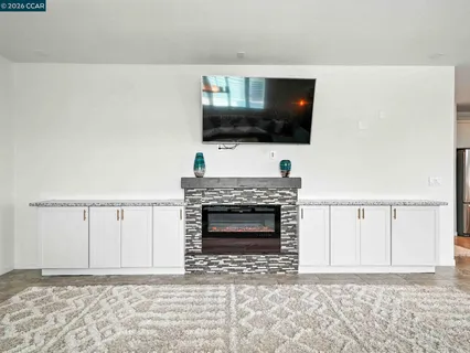 a bedroom with a bed and a cabinets
