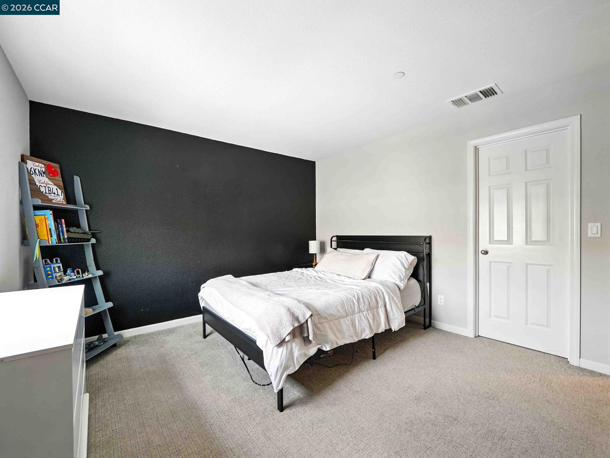 2433 Sanders Lane Fairfield, CA 94533 - Photo 23 of 51 a bedroom with a bed and a cabinets