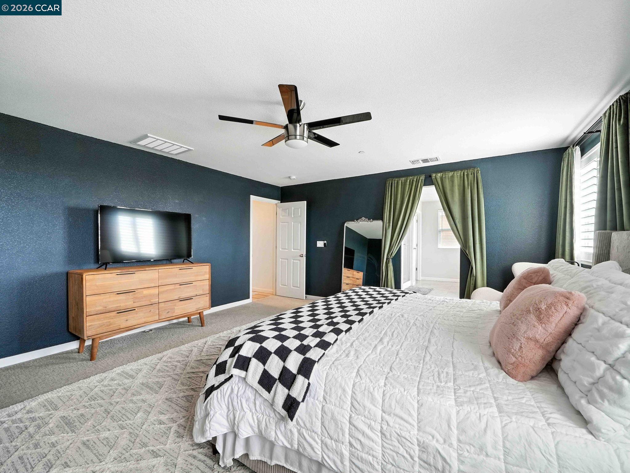 2433 Sanders Lane Fairfield, CA 94533 - Photo 32 of 51 a bedroom with a large bed and a window