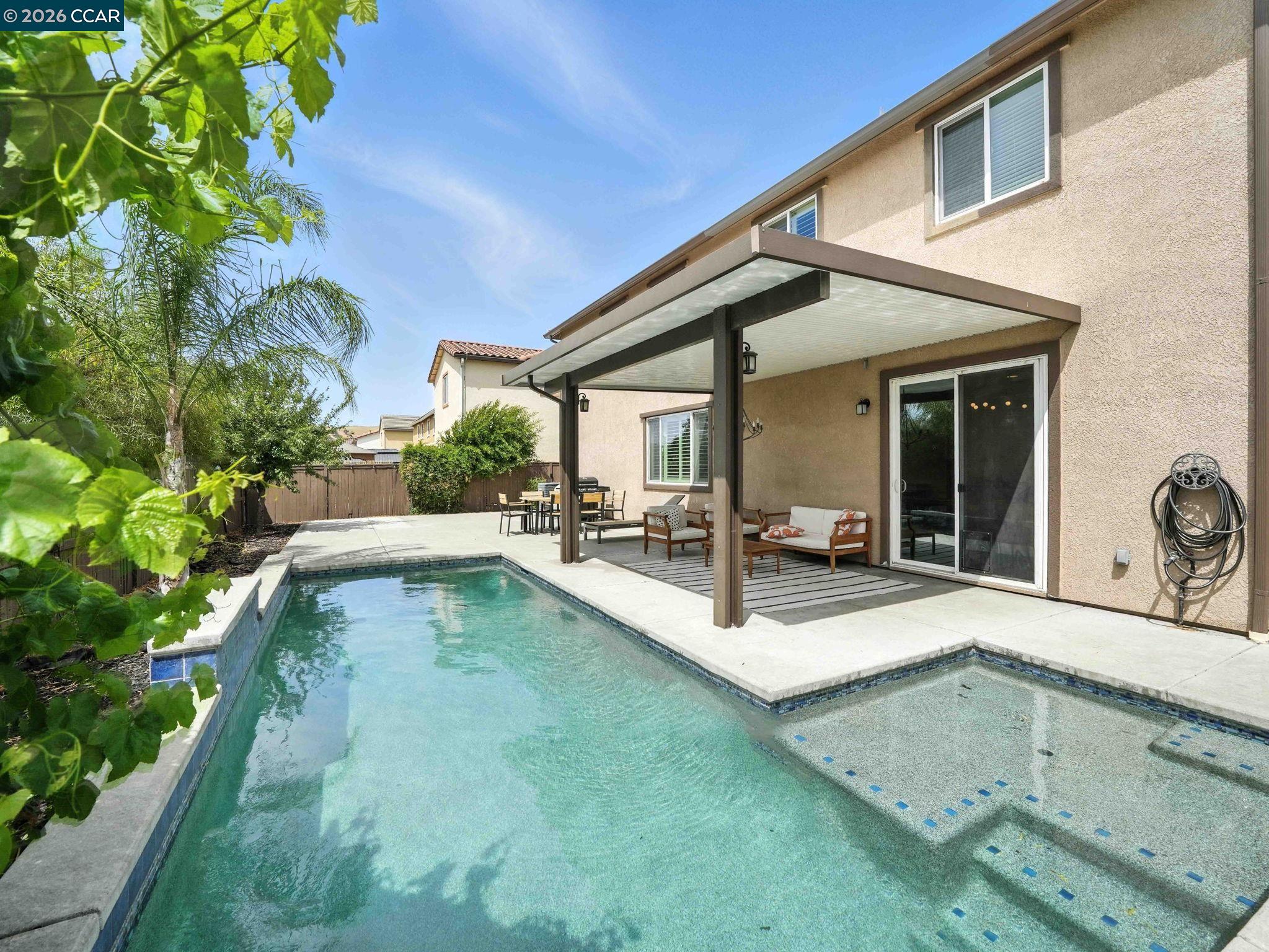 2433 Sanders Lane Fairfield, CA 94533 - Photo 44 of 51 a view of a patio with swimming pool table and chairs