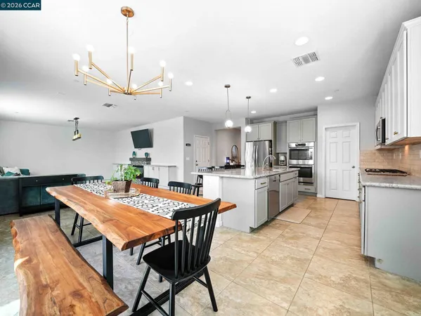 a kitchen with cabinets and stainless steel appliances