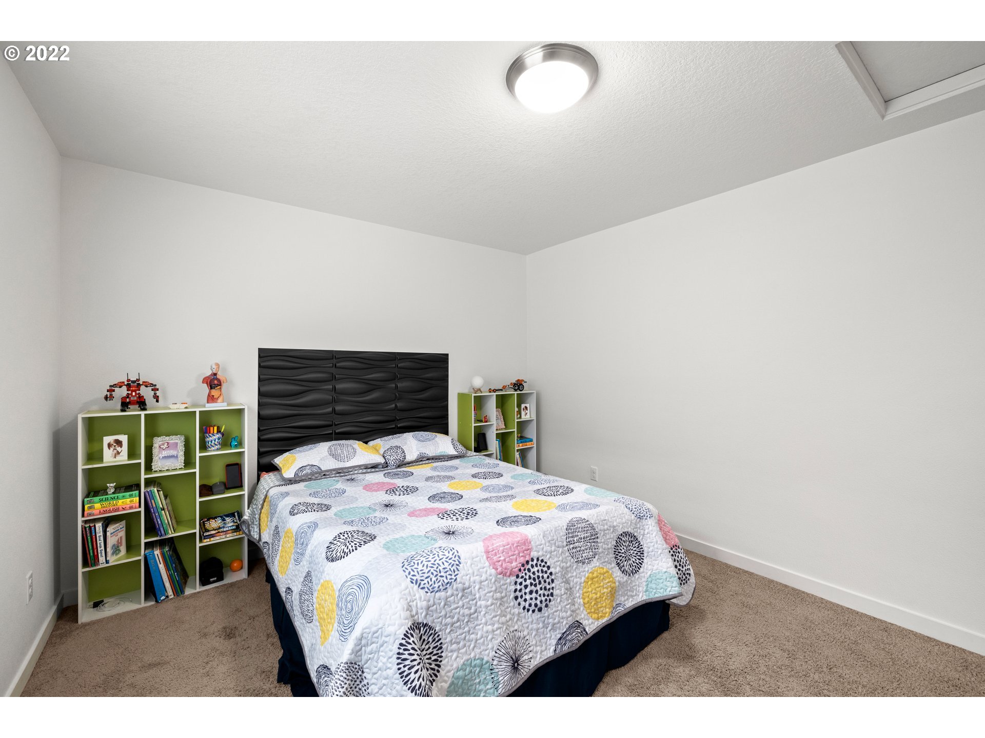 951 Southwest Draper Terrace Beaverton, OR 97003 - Photo 17 of 32 a bedroom with a bed and a wooden floor