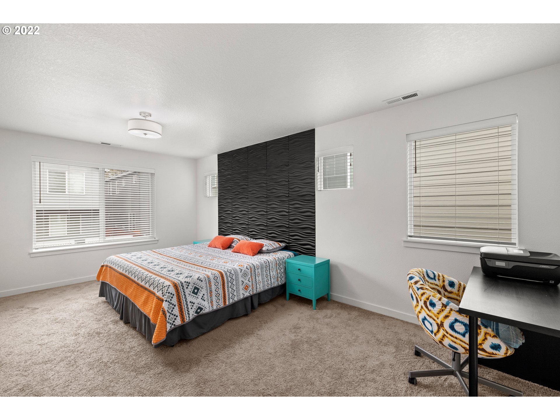 951 Southwest Draper Terrace Beaverton, OR 97003 - Photo 21 of 32 a spacious bedroom with a bed and a window