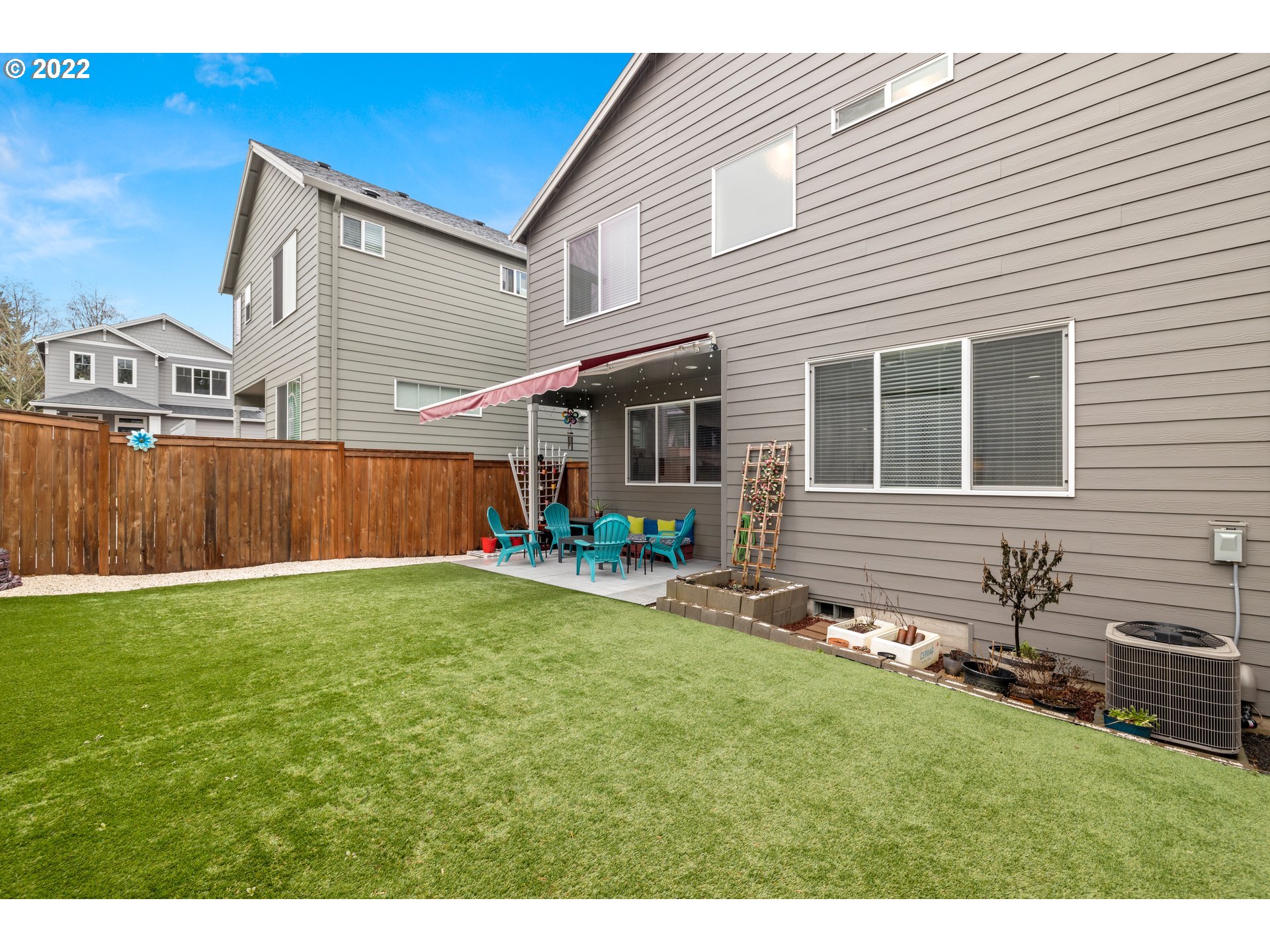951 Southwest Draper Terrace Beaverton, OR 97003 - Photo 30 of 32 a view of a backyard with table and chairs and wooden fence