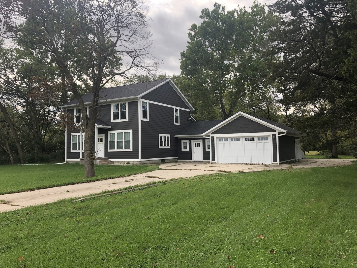2517 East 275th Road Peru, IL 61354 - Photo 1 of 15 a front view of a house with a yard and trees