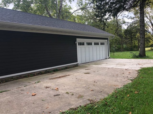 2517 East 275th Road Peru, IL 61354 - Photo 13 of 15 a front view of a house with a yard and garage