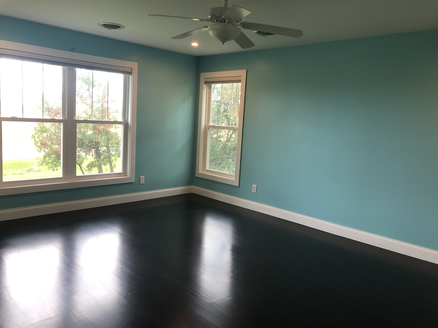 2517 East 275th Road Peru, IL 61354 - Photo 7 of 15 an empty room with wooden floor and windows