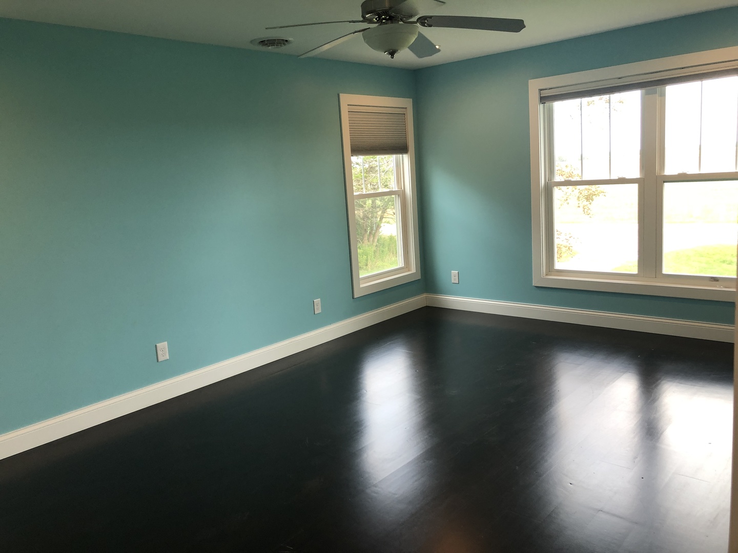 2517 East 275th Road Peru, IL 61354 - Photo 8 of 15 an empty room with wooden floor and windows with curtains