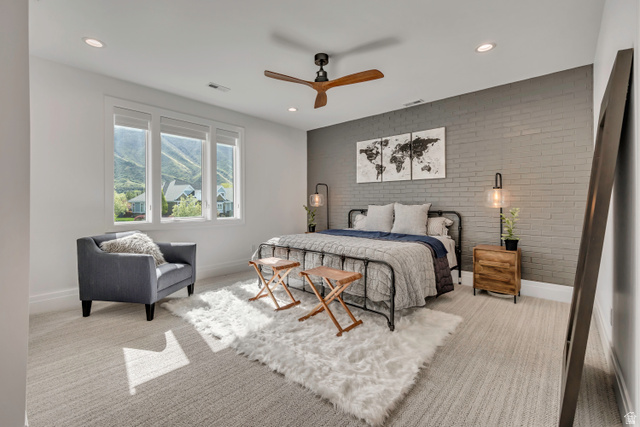 1720 Hillcrest Circle Mapleton, UT 84664 - Photo 66 of 116 Bedroom featuring brick wall, a ceiling fan, an accent wall, recessed lighting, and light colored carpet