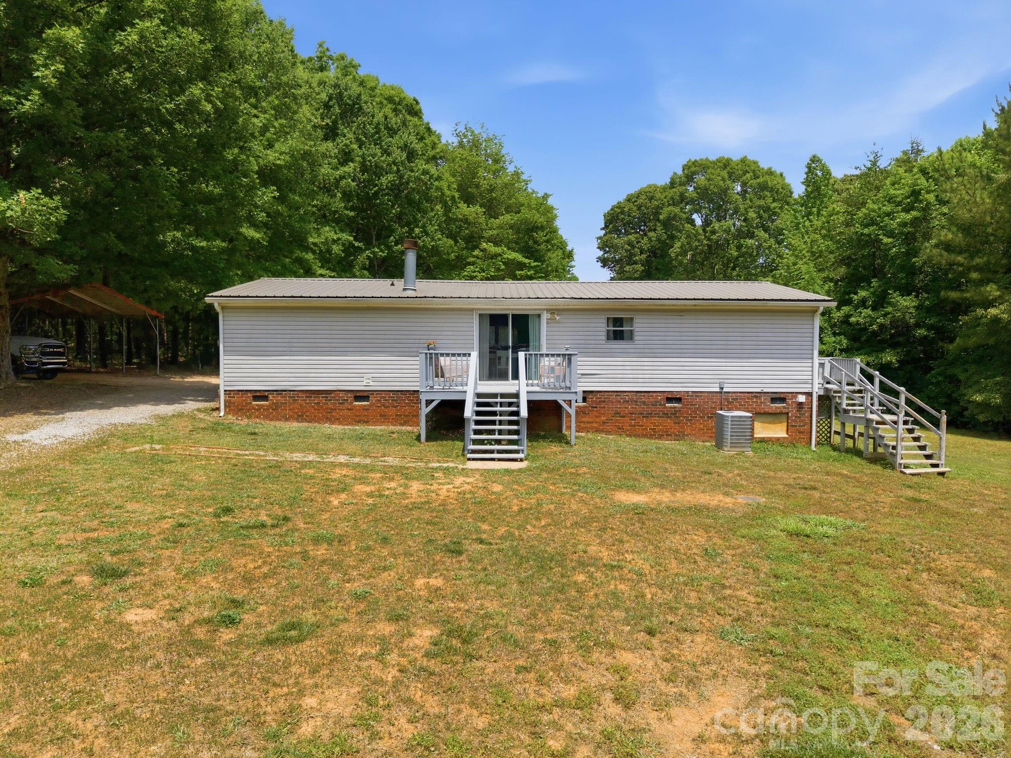 675 Overcash Road Salisbury, NC 28147 - Photo 36 of 48 a view of a house with pool and a yard
