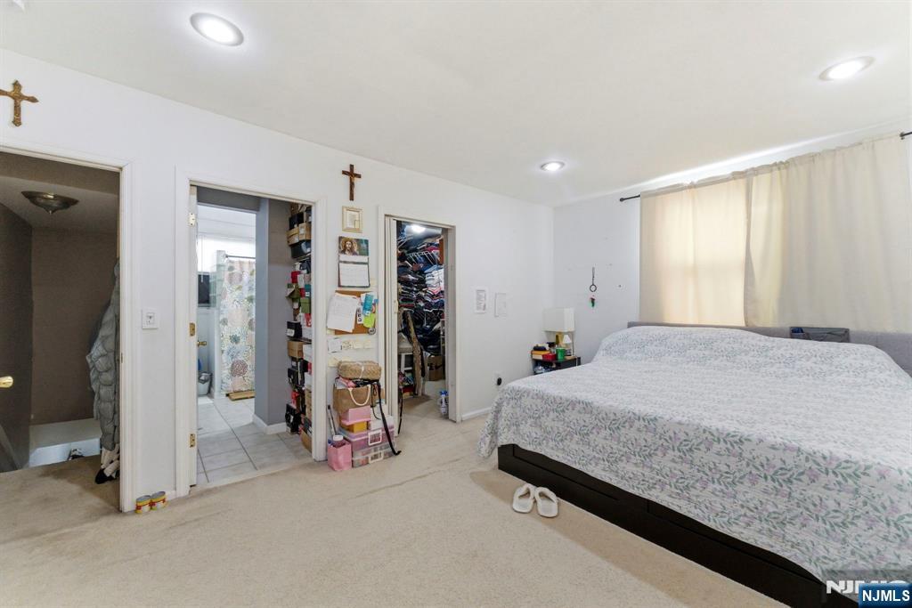 270 Westervelt Place Lodi, NJ 07644 - Photo 14 of 17 a room with a bed and a large window