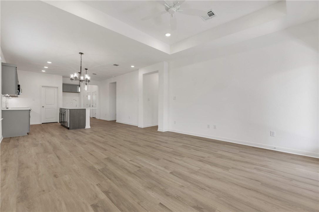 2776 Messenger Way Bryan, TX 77803 - Photo 7 of 16 an empty room with wooden floor and windows
