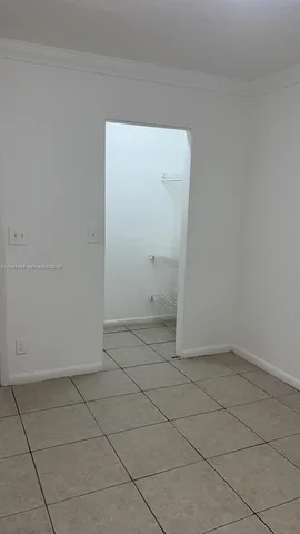 an empty room with a bathroom